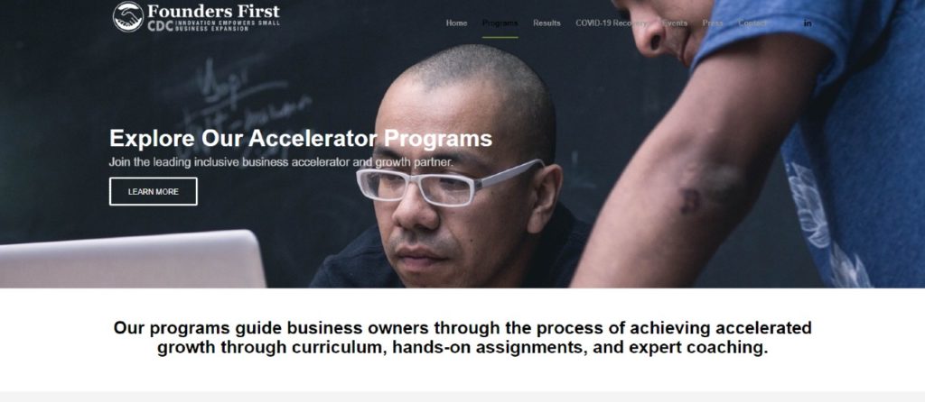 Header image of two people looking at a laptop computer and an overview of the Founders First accelerator program.