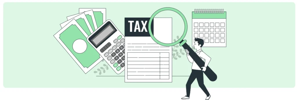 Person holding a microscope over a tax document, which is next to a calculator and money.